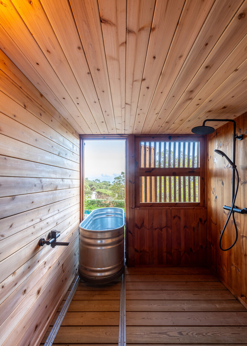 madeiguincho's wooden sauna frames panoramic views of the lush portuguese landscape