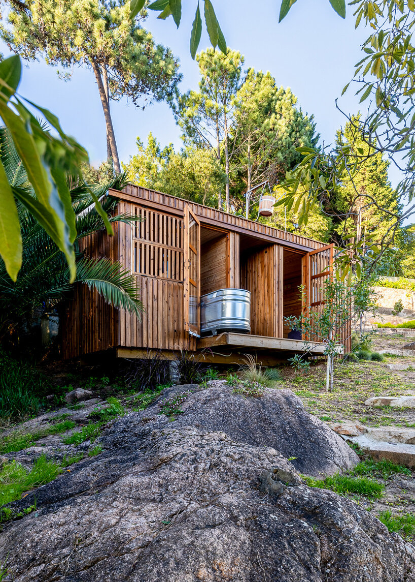 madeiguincho's wooden sauna frames panoramic views of the lush portuguese landscape