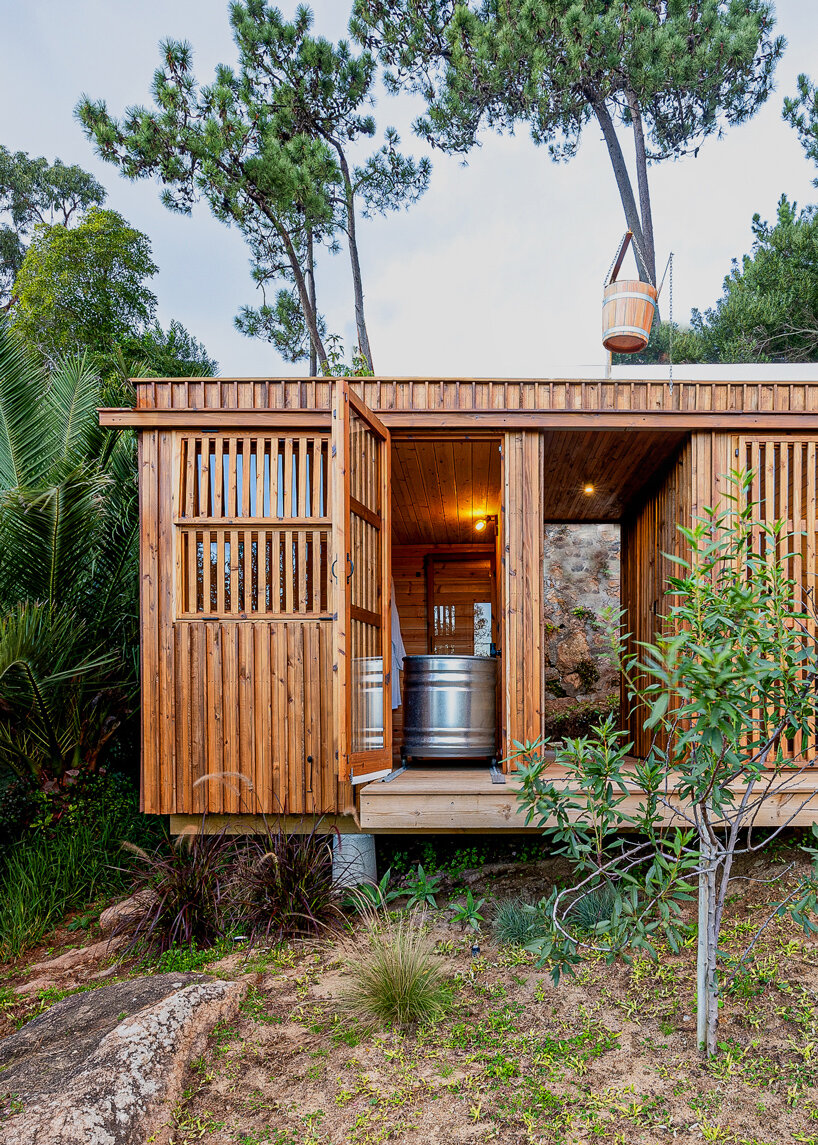 madeiguincho's wooden sauna frames panoramic views of the lush portuguese landscape