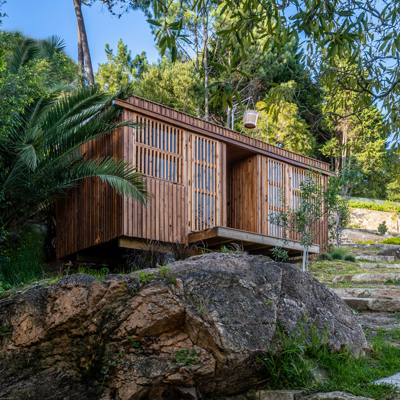 madeiguincho's wooden sauna frames panoramic views of the lush portuguese landscape