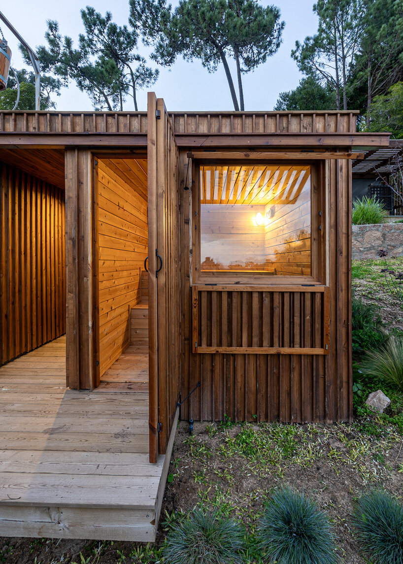 madeiguincho's wooden sauna frames panoramic views of the lush portuguese landscape