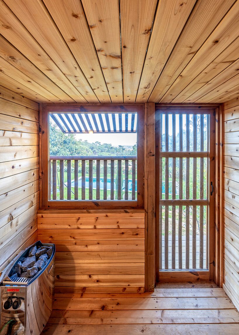 madeiguincho's wooden sauna frames panoramic views of the lush portuguese landscape