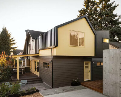 butter-yellow paint coats revamped family home's facade in seattle