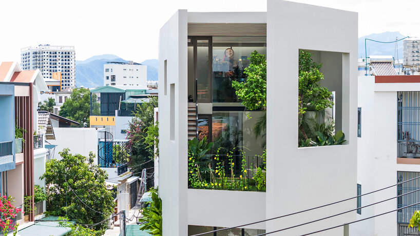 cut-out patios bring nature inside pham huu son's skygarden house in vietnam