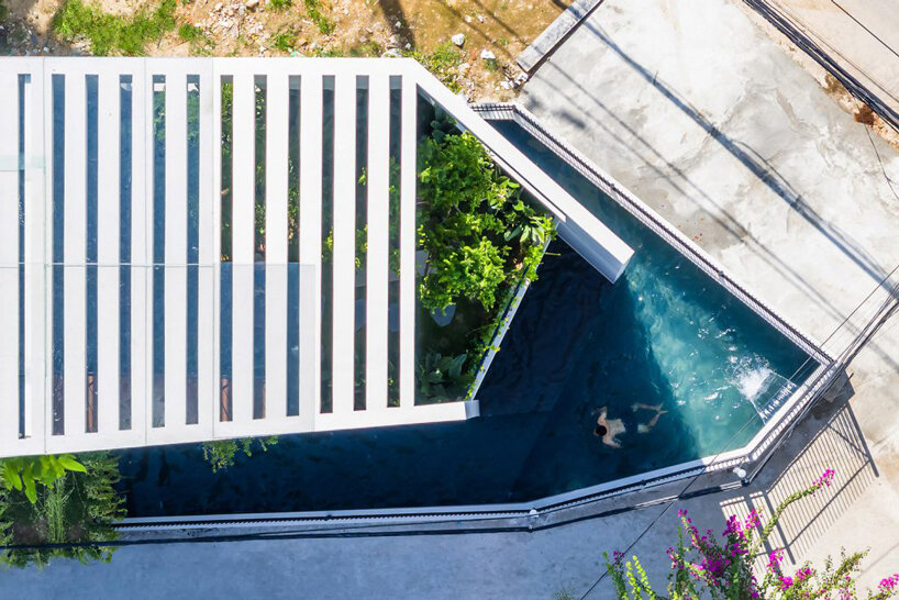 cut-out patios bring nature inside pham huu son's skygarden house in vietnam