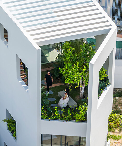cut-out patios bring nature inside pham huu son's skygarden house in vietnam