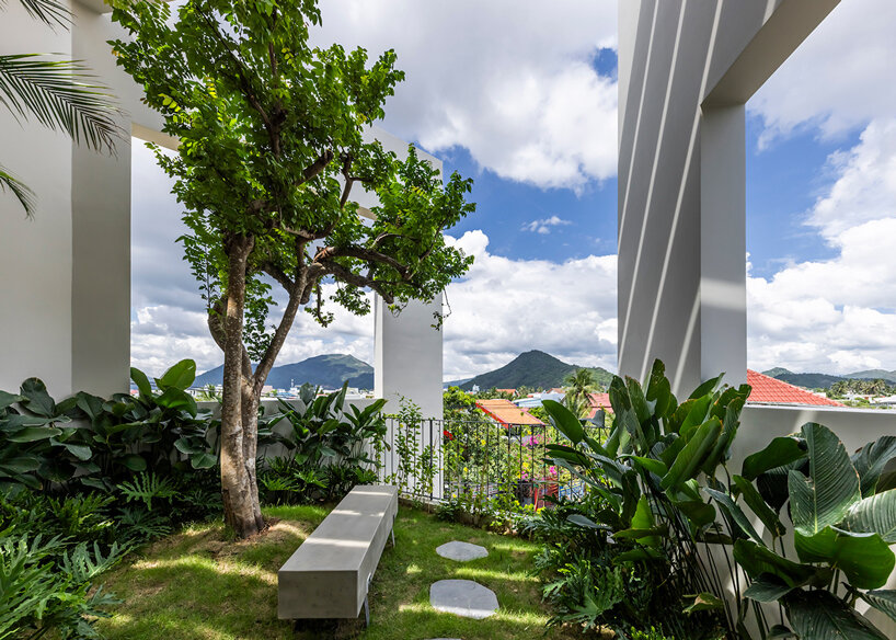 cut-out patios bring nature inside pham huu son's skygarden house in vietnam