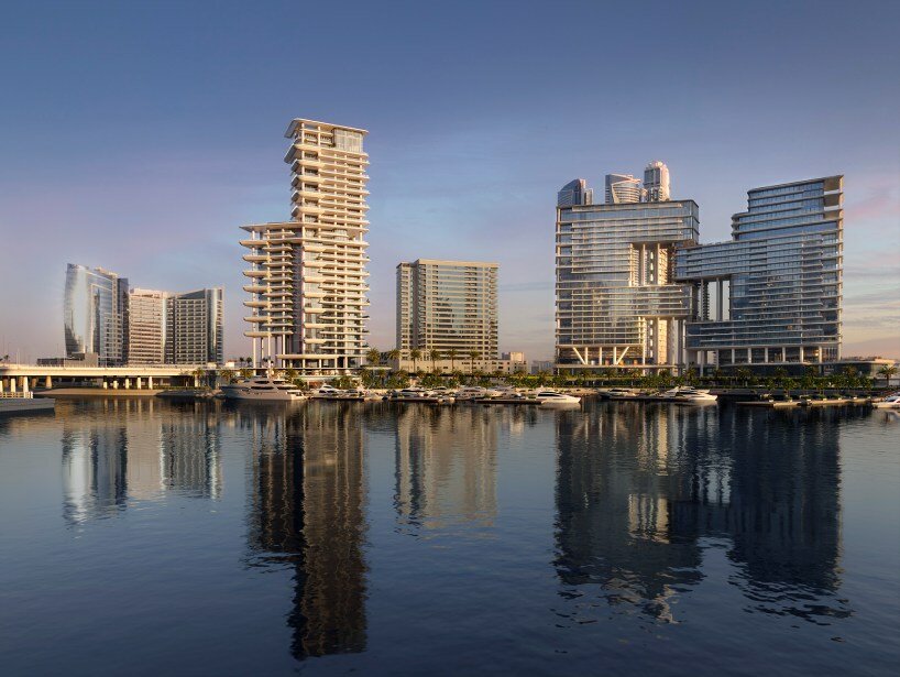 fluid curves and wraparound pools embrace foster + partners' waterfront tower in dubai