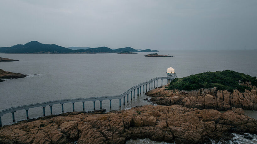 covered in sheer white mesh, this daydream trail station casts a poetic glow in coastal china