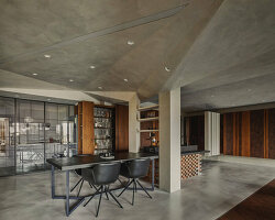 multifaceted concrete ceiling floats above residential space in taiwan