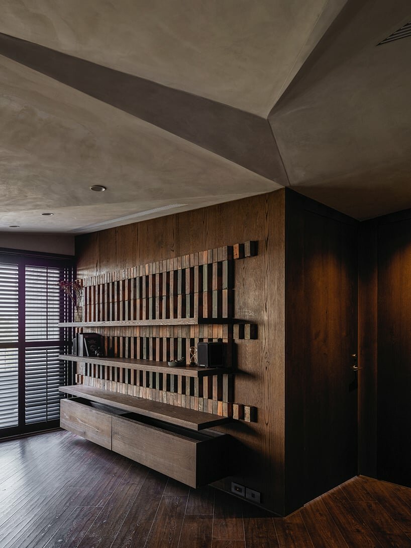 multifaceted concrete ceiling floats above residential space in taiwan