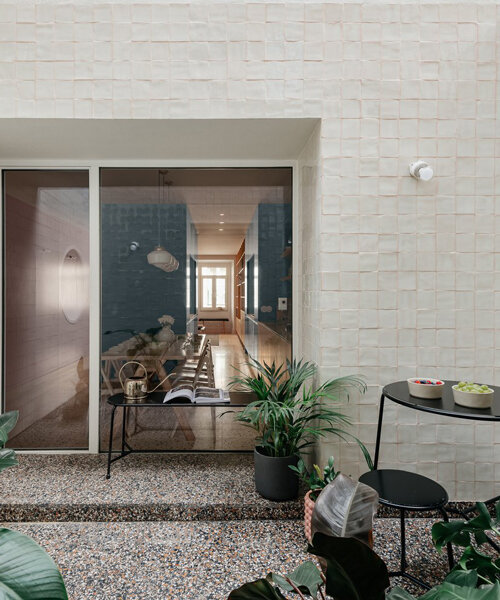 ala.rquitectos integrates light-filled courtyard into renovated lisbon apartment