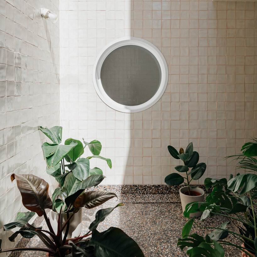 ala.rquitectos integrates light-filled courtyard into renovated lisbon apartment