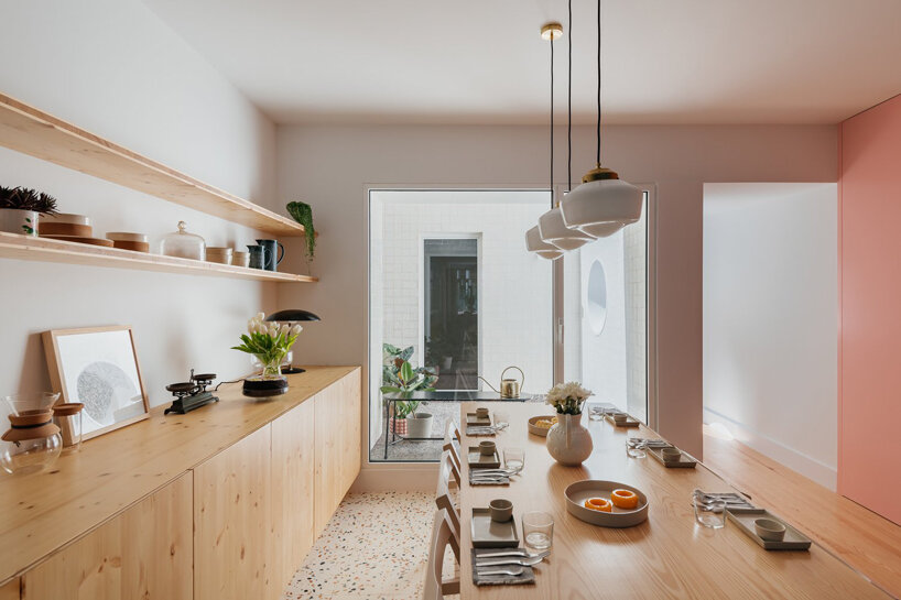 ala.rquitectos integrates light-filled courtyard into renovated lisbon apartment