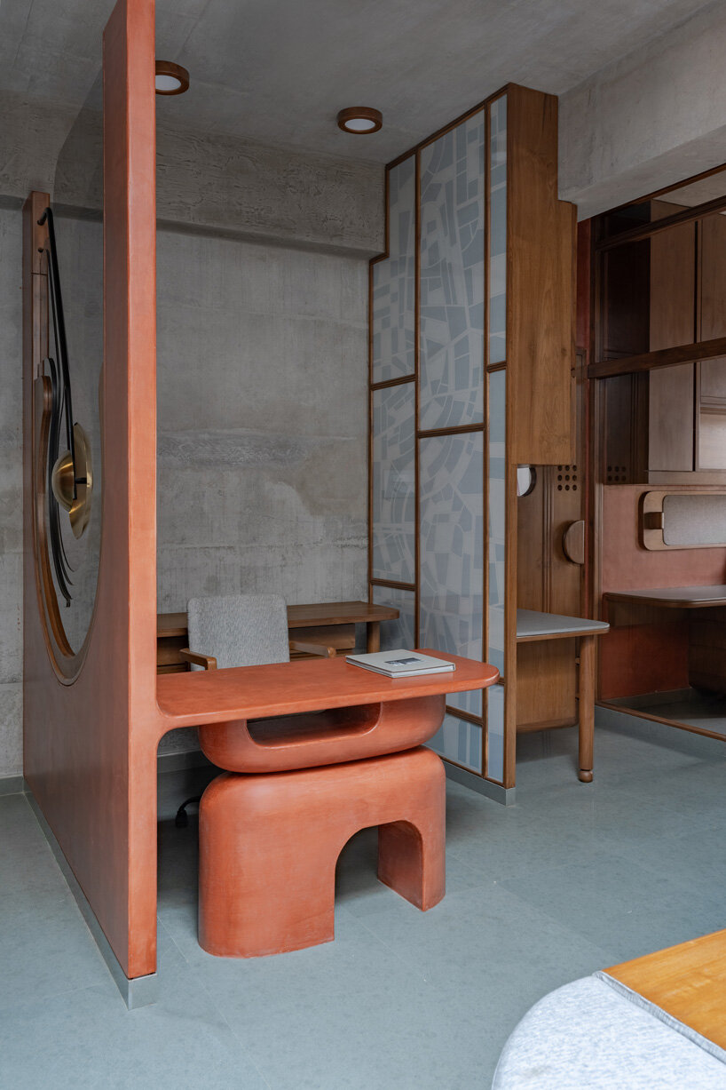 warm terracotta hues adorn design ni dukaan's sculptural office interior in india