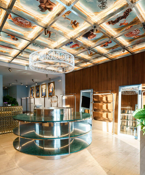 faux coffered ceiling displays famous artworks in milan flagship store by el departamento