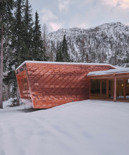 handmade copper shingles wrap secluded hut in the austrian alps