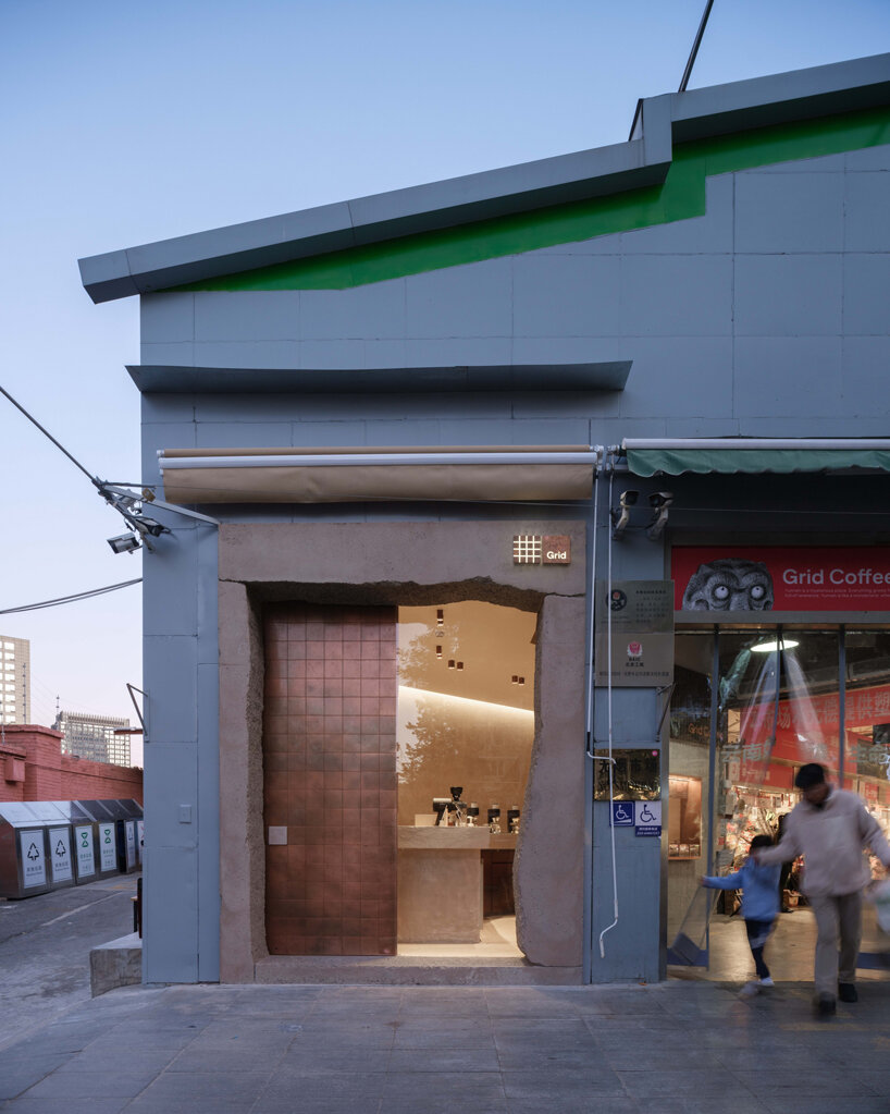 tiny café by B.L.U.E. architecture studio pops amidst traditional marketplace in beijing