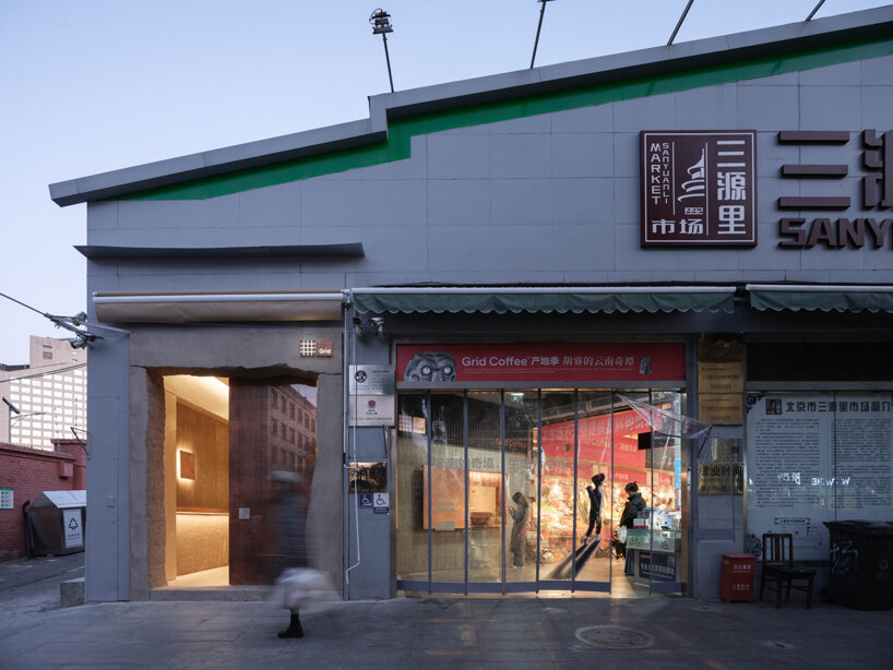 tiny café by B.L.U.E. architecture studio pops out amidst traditional marketplace in beijing