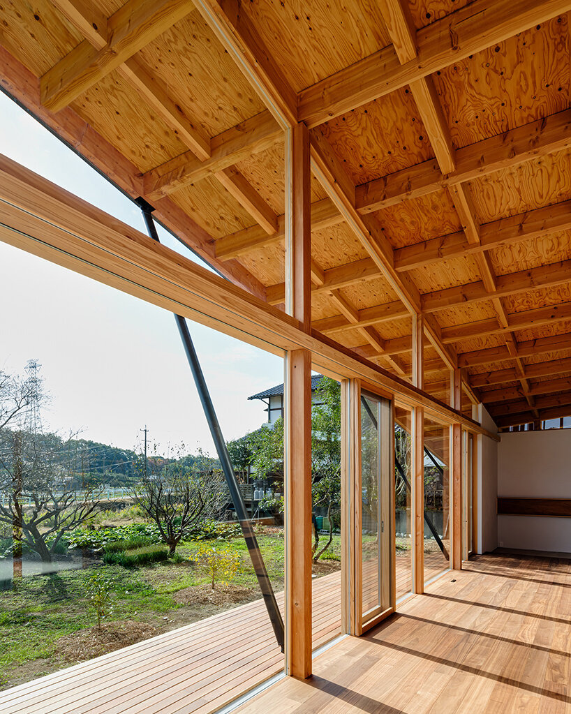 tatsuya kawamoto tops 'hazamacho house' with a hyperbolic paraboloid in rural japan