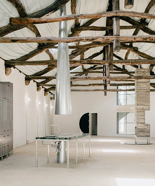 fala atelier transforms former warehouse into 'the house of many faces' in portugal