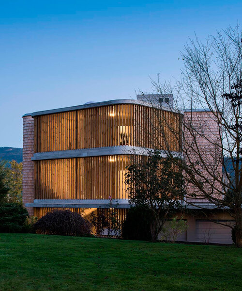 comamala ismail clothes residence's concrete structure with split fir shingles in switzerland