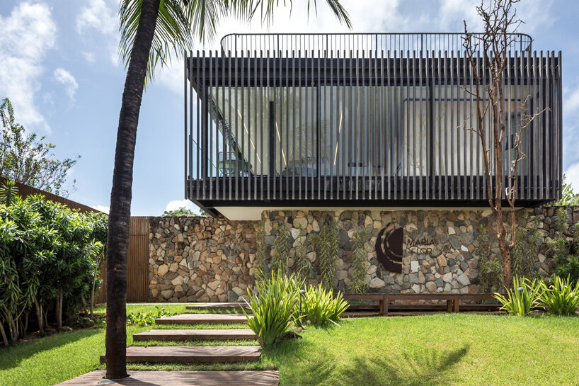 permeable wooden cladding merges boutique hotel with nature on brazilian island