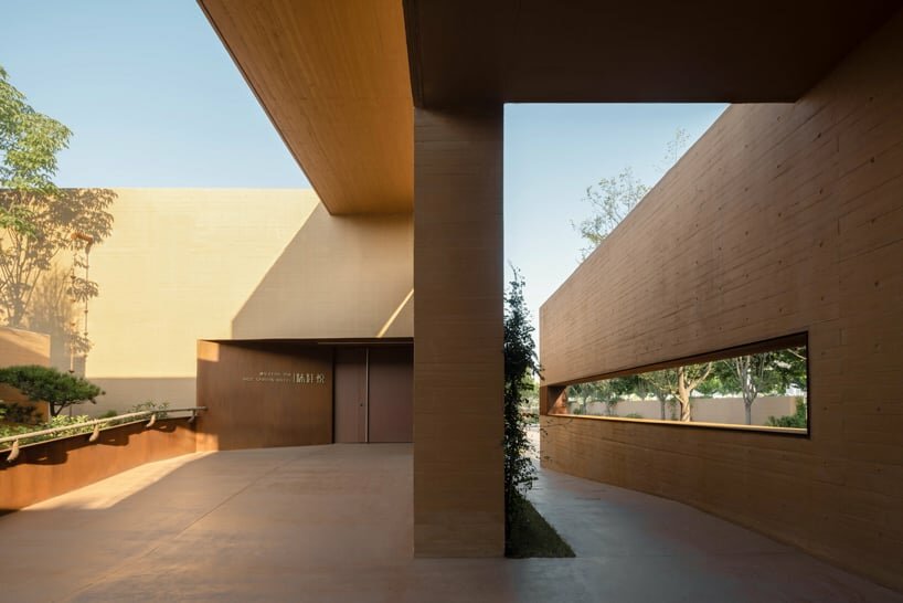 earth-toned concrete walls intertwine to form hot spring hotel by studio A+ in china
