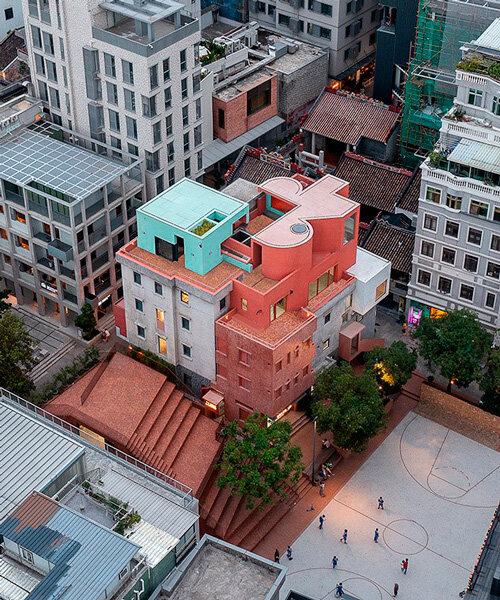 colorful geometric volumes by URBANUS extend atop old building in china