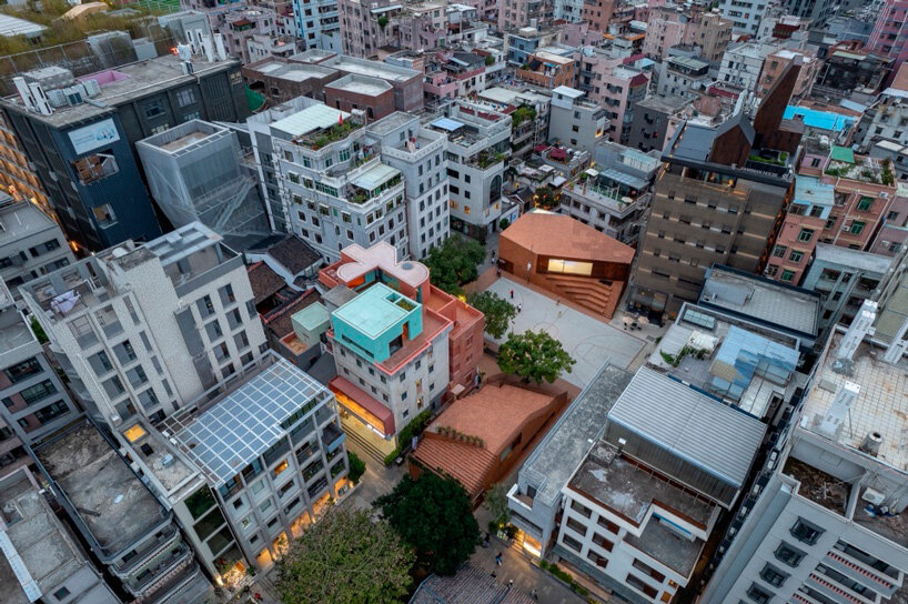 colorful geometric volumes by URBANUS extend atop old building in china
