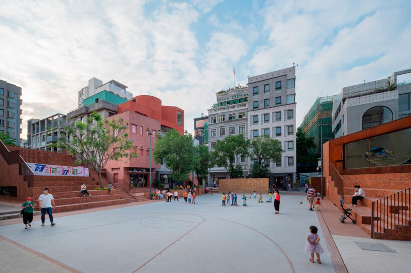 colorful geometric volumes by URBANUS extend atop old building in china