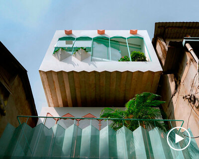 jagged cantilever protrudes from AD+studio's house on a narrow alley in vietnam