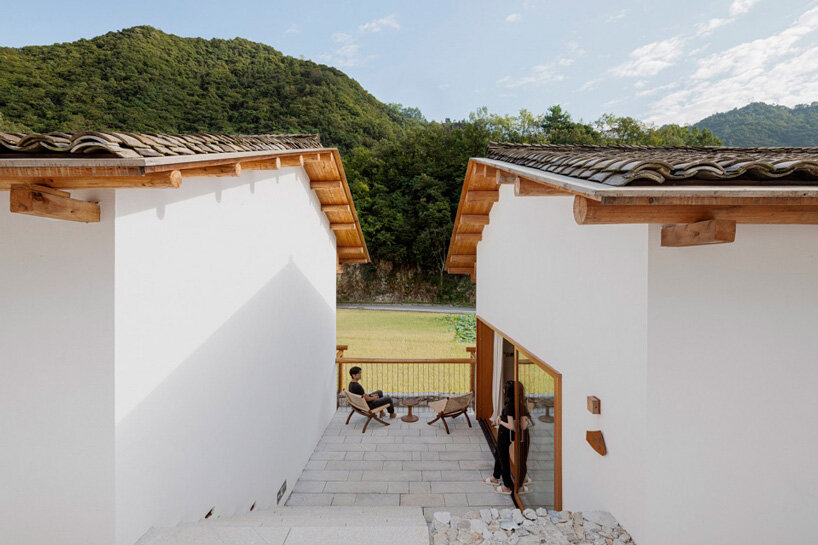 kooo architects embeds terraced pathways between hotel cottages in china