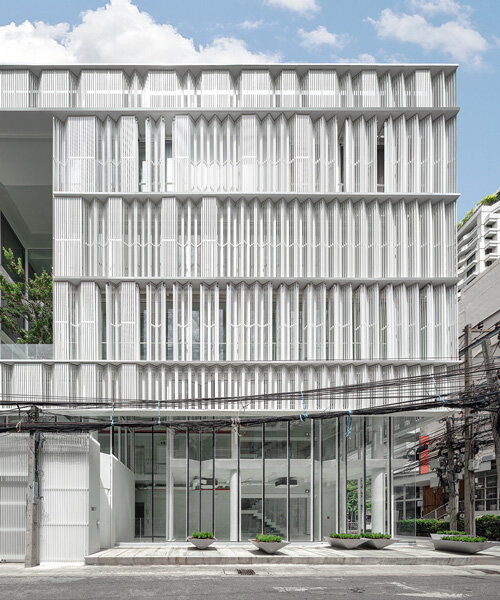 zigzag curtain wall enfolds silom residence's living units in bangkok