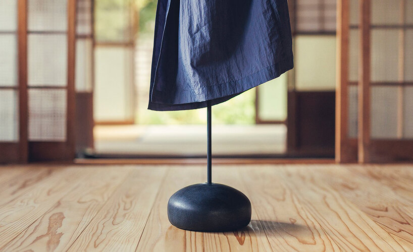 spindle coat rack by koichi futatsumata gently sways when garments are hung on it