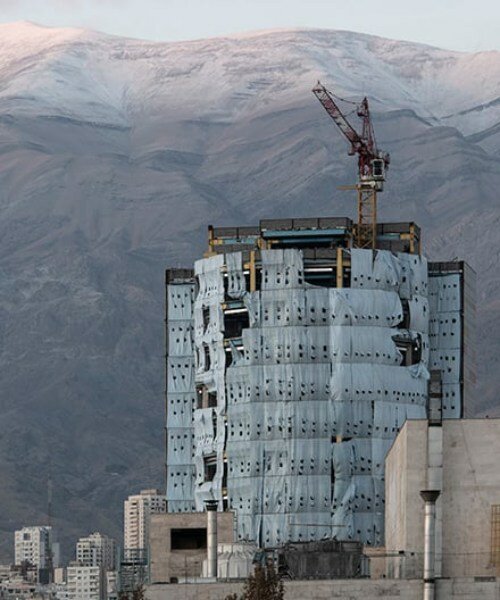 manuel alvarez diestro captures construction crane silhouettes against tehran’s cityscape