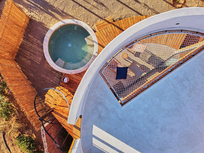 terraces and hanging bridges connect the zeuhary cabins in a mexican vineyard