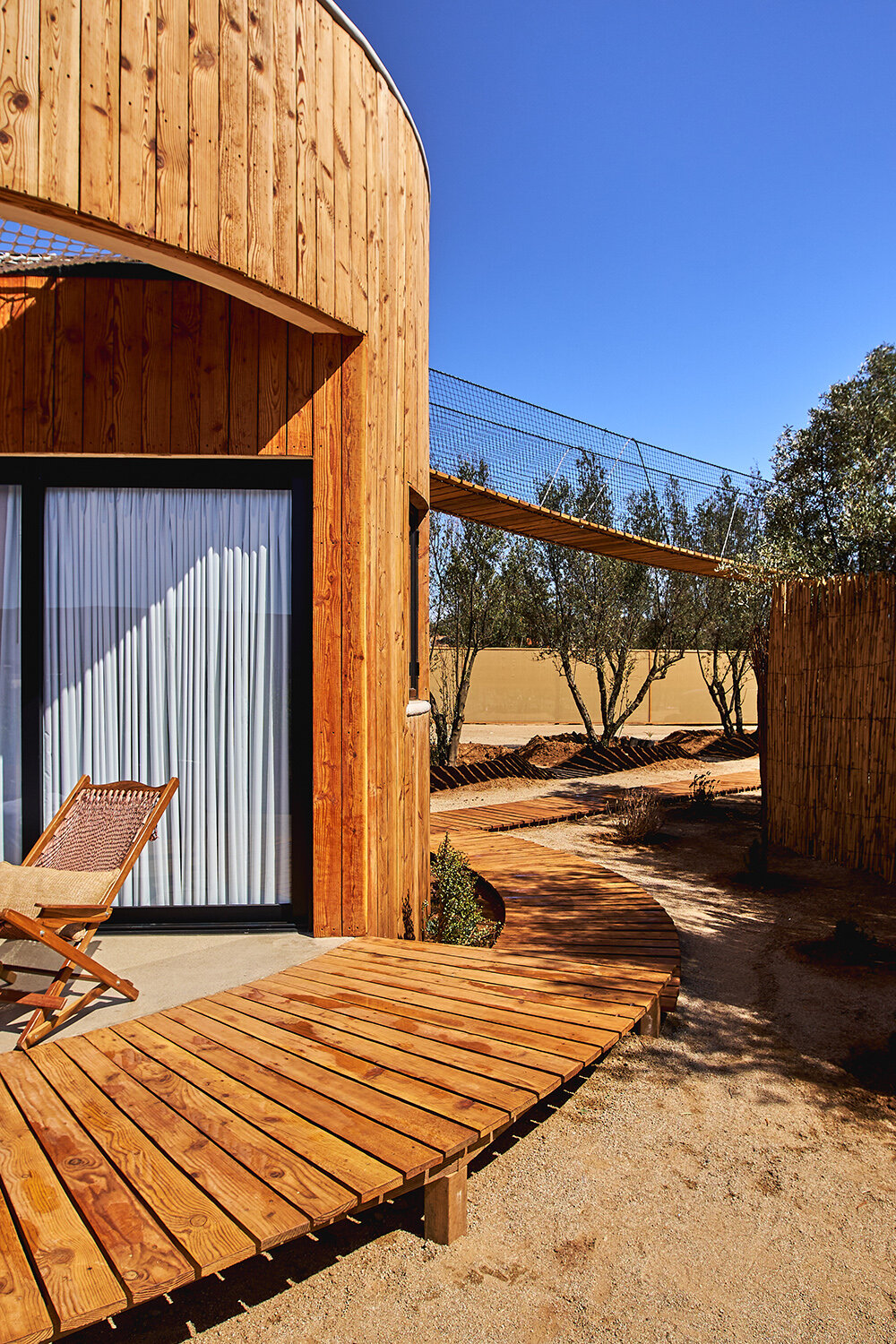 terraces and hanging bridges connect the zeuhary cabins in a mexican vineyard