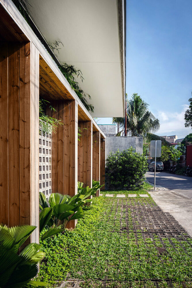 concrete block screen welcomes sunlight and gentle breeze in platform 21's manila residence