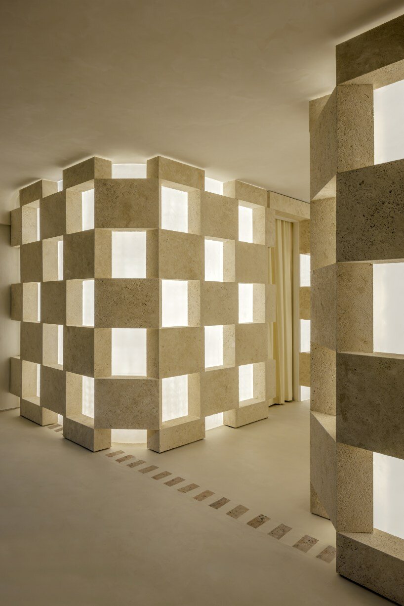 soaring sculpture and banyan tree pierce oculi of sugarhouse's miami fashion store