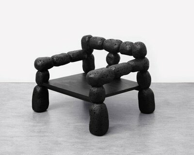 ae office’s cork furniture captures the raw beauty of volcanic black stone in korea