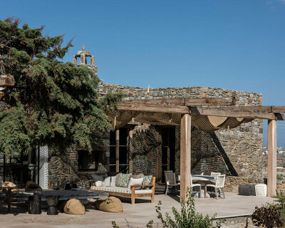mykonos architects compose yoga retreat within stone-clad cycladic house