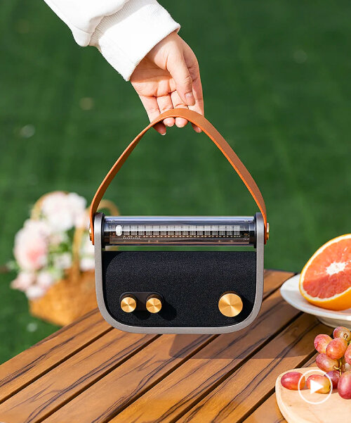 LUNA audio is a bluetooth radio with fluorescent display that can be carried like a handbag