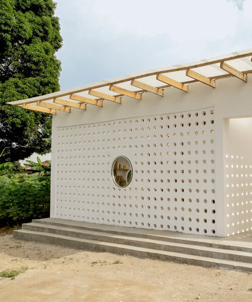 perforated mud brick exterior shields mariam's library by parallel studio in tanzania