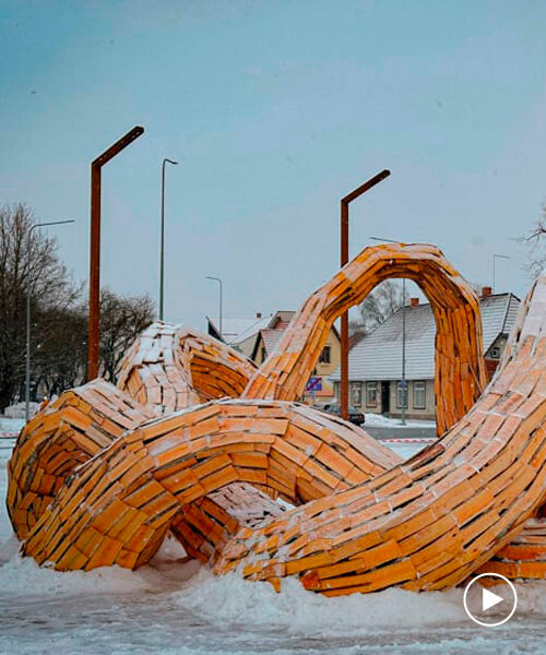 wooden shingles compose uv lab's undulating snake-like public installation in estonia