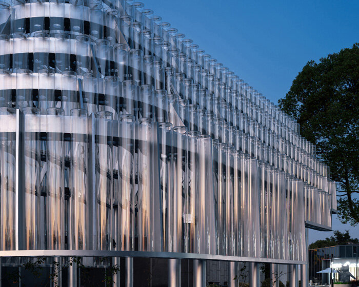 five stacks of glass tubes construct arc-shaped pavilion lucida by deep origin lab in china