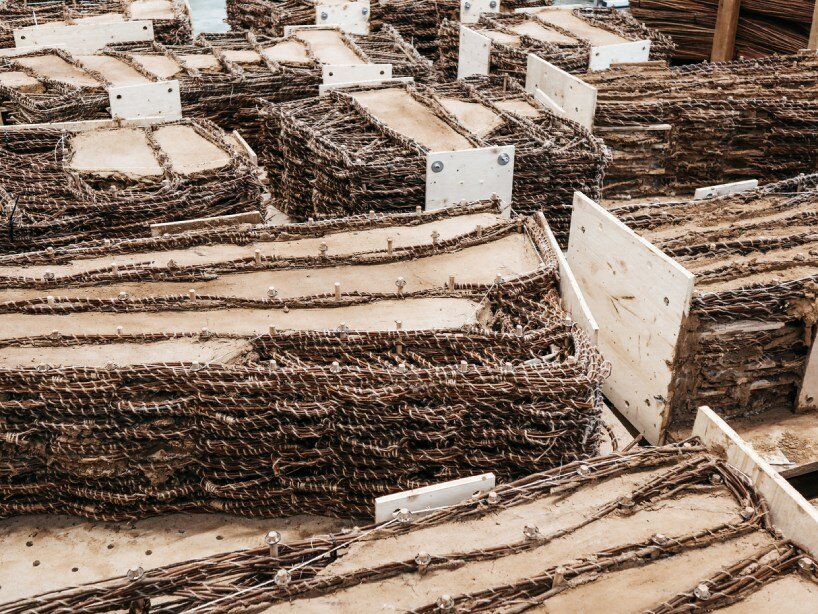 regrow willow poses hybrid earth construction system strengthened with digital fabrication