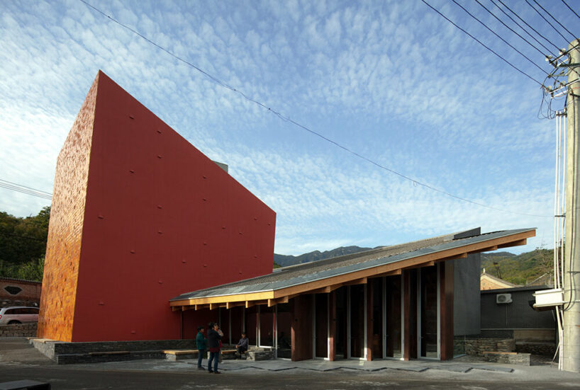 WAAAM museum's glazed yellow facade enlivens the beigou village in china