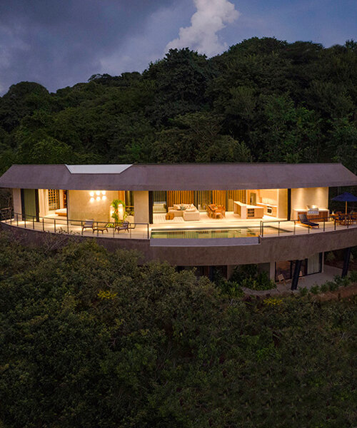 ansui house nosara by modus operandi aligns with its curvilinear site in costa rica