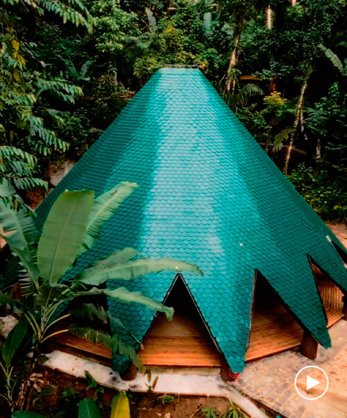 ceramic tiles in blue and green hues cover tapered ayuru forest temple in brazil